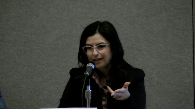 Health Net Medi-Cal President Martha Santana-Chin gestures during panel discussion at Insure the Uninsured Project 2023 Conference
