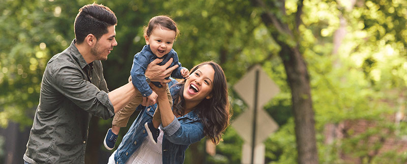 Man, woman, and child enjoying the outdoors