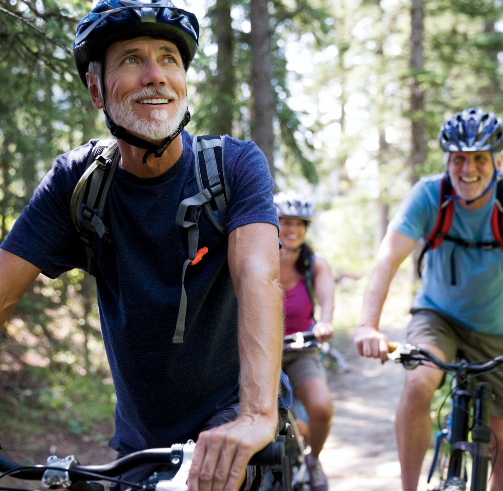 man on bicycle in forest